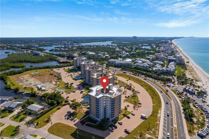 Aerial overview of property's location with a nearby body of water