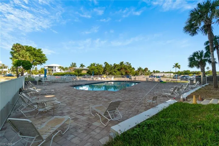 Community pool with a patio area