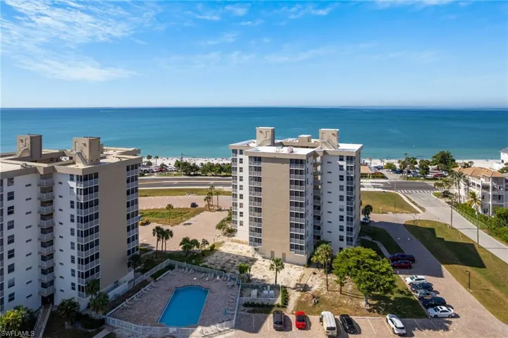 Aerial view of apartment complex and a large body of water