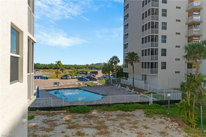 Community pool featuring a patio