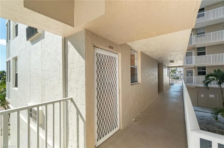 Entrance to property featuring stucco siding