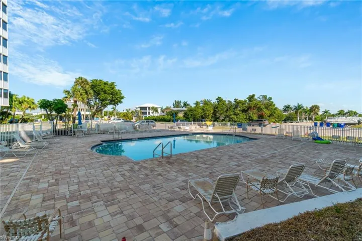 Community pool with a patio area
