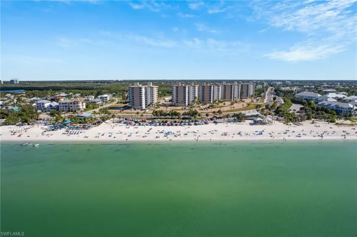 Drone / aerial view of waterfront with a beach