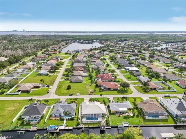 Drone / aerial view featuring a water view and a residential view