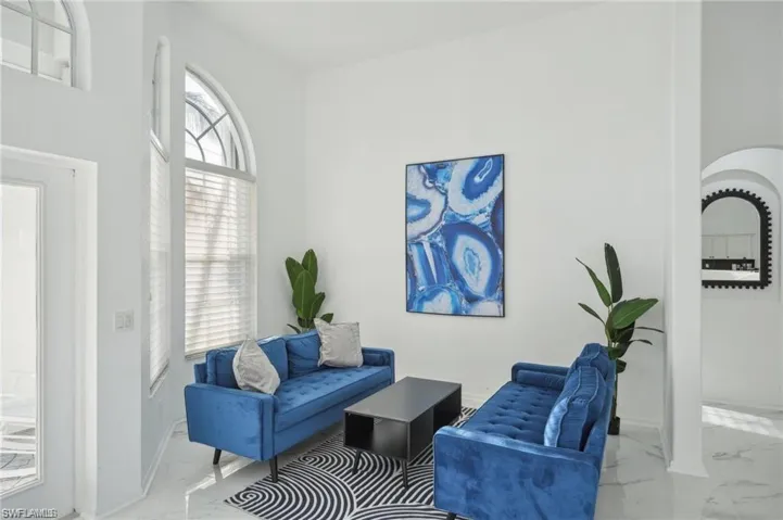 Living area with marble finish floor