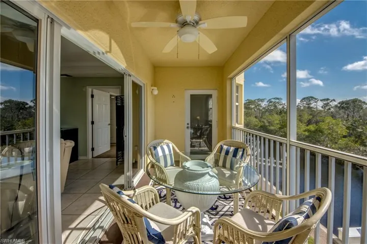 Sunroom featuring ceiling fan