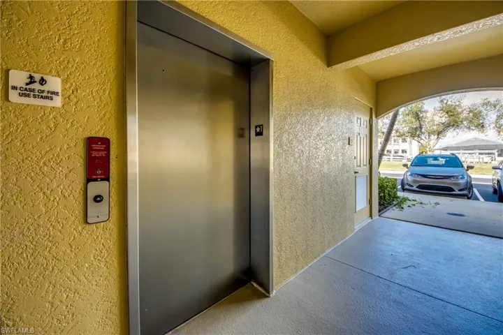 View of exterior entry featuring elevator
