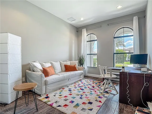 Office featuring dark wood-style flooring, recessed lighting, and baseboards