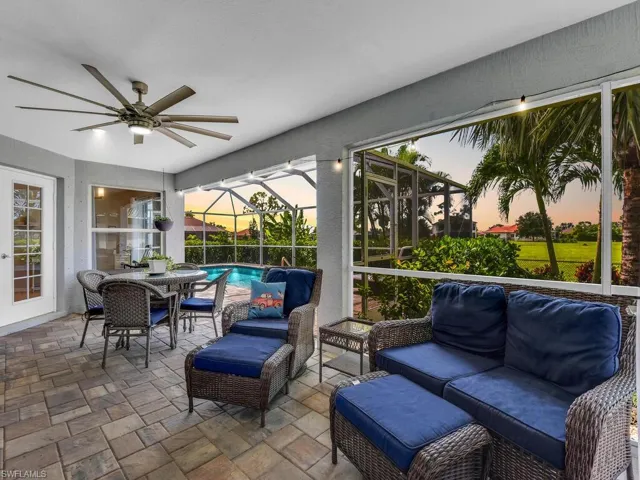 Sunroom with an outdoor hangout area, ceiling fan, a patio, and plenty of natural light