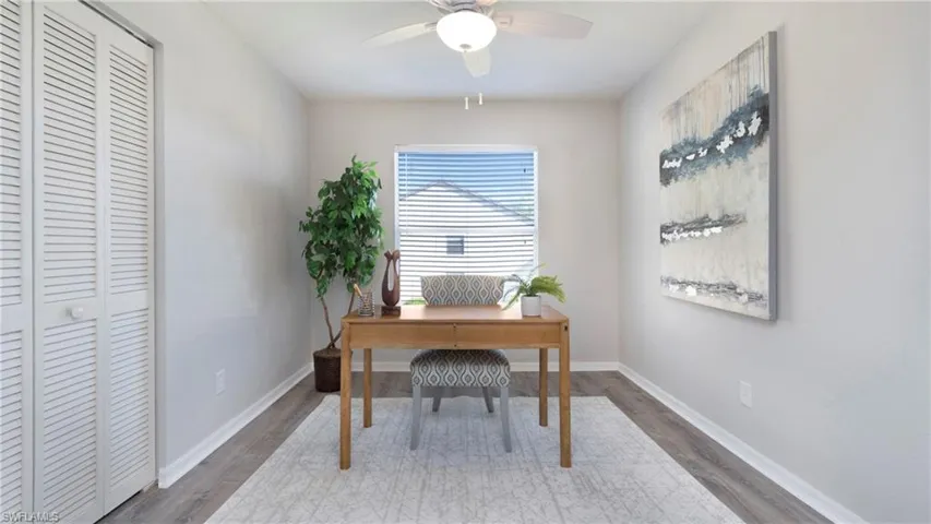 Office space with wood finished floors and ceiling fan