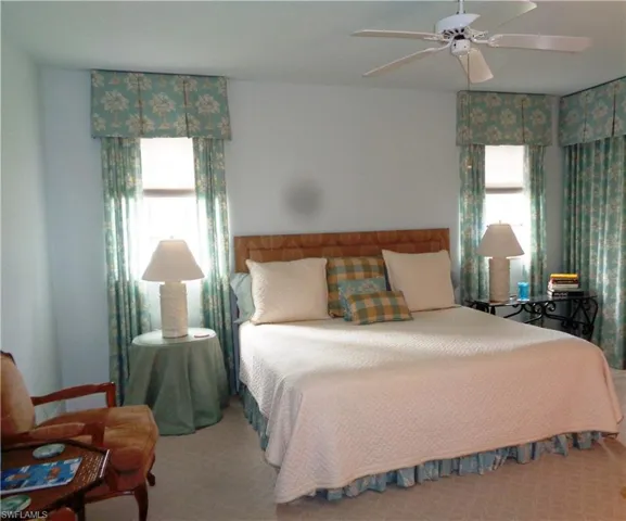 Bedroom featuring carpet and ceiling fan
