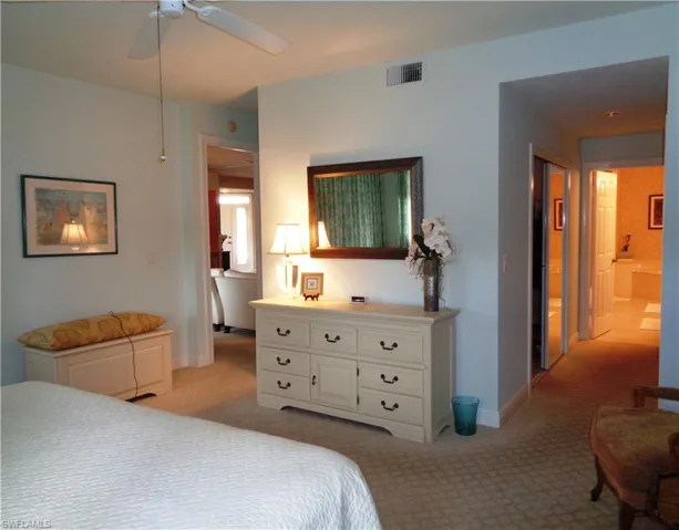 Bedroom featuring light carpet and ceiling fan