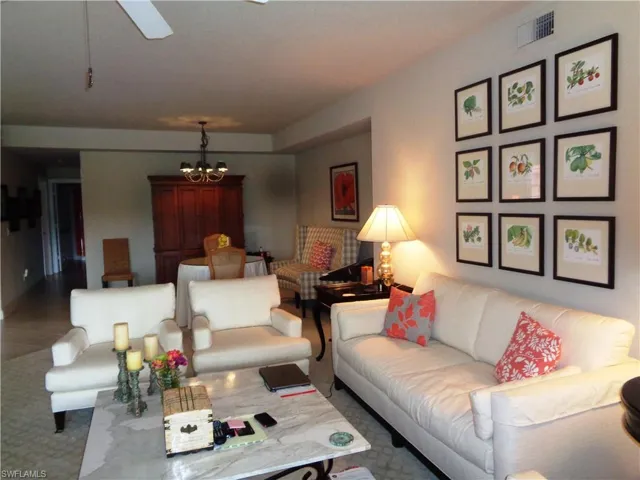 Living area with a chandelier and ceiling fan
