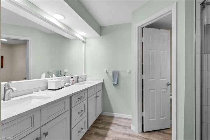 Bathroom featuring hardwood / wood-style flooring and vanity