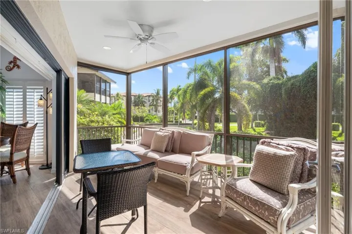 Sunroom / solarium featuring ceiling fan