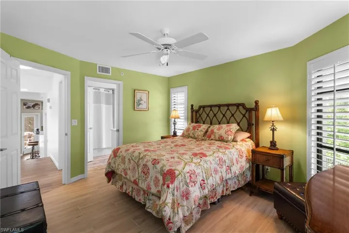 Bedroom featuring ceiling fan and light wood-type flooring