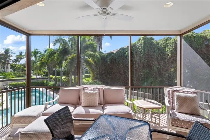 Sunroom featuring ceiling fan