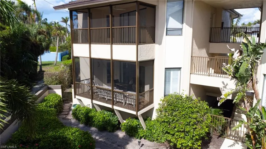 Rear view of property featuring a sunroom