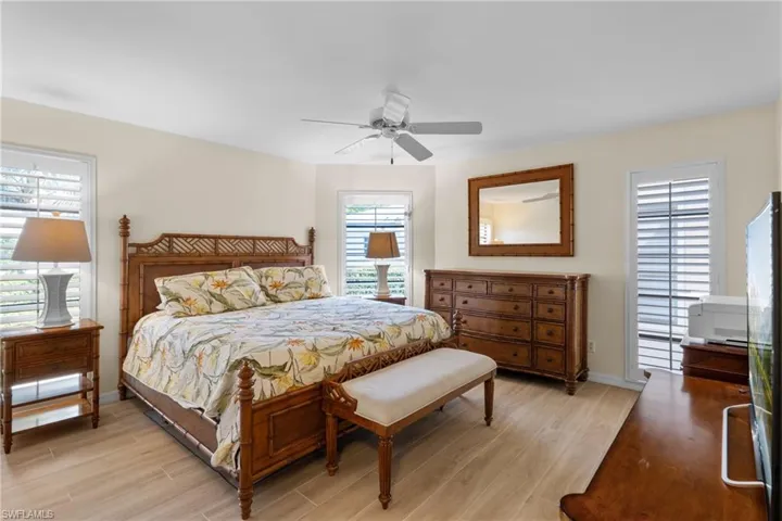 Bedroom featuring ceiling fan and light hardwood / wood-style flooring