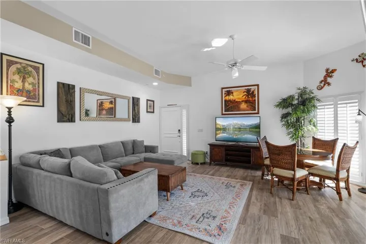 Living room featuring hardwood / wood-style floors and ceiling fan