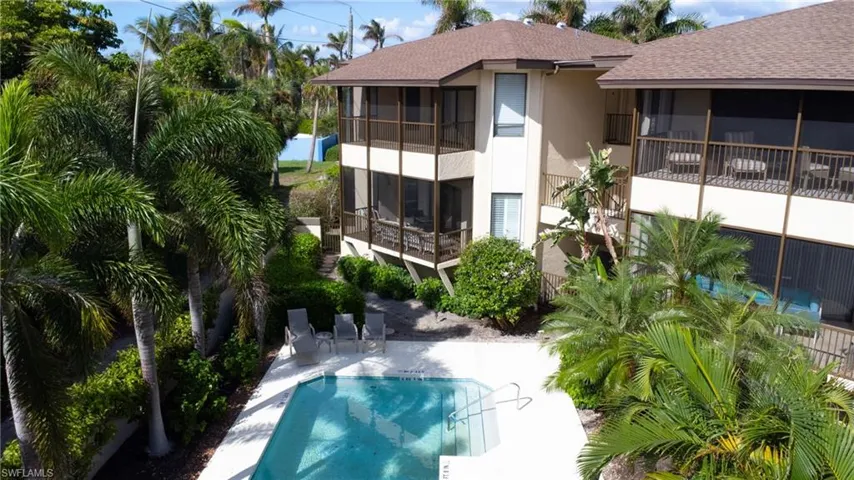 View of pool featuring a sunroom and a patio area