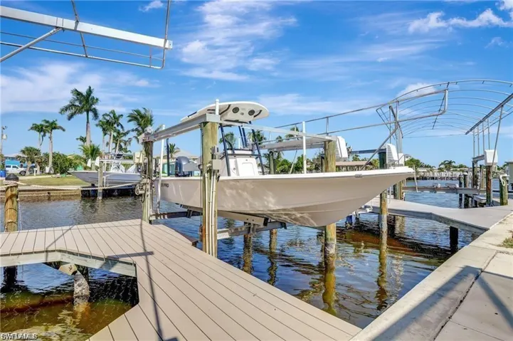 Dock with a water view and boat lift