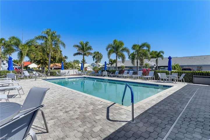 Community pool with a patio area