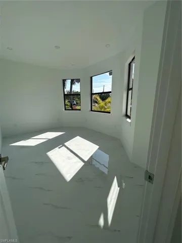 Empty room featuring marble finish flooring