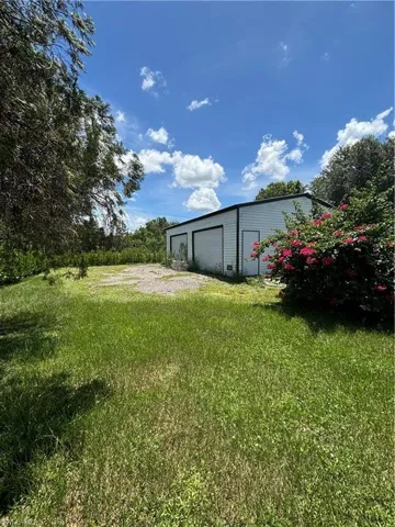 View of yard with an outbuilding