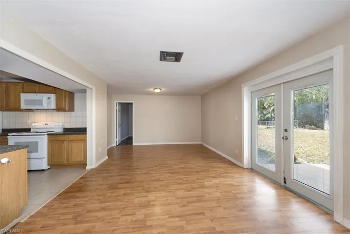 Family room/dining room, two sets of French doors leading to the back yard