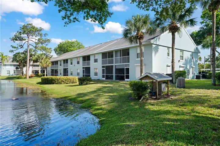 View of apartment building / complex with a water view