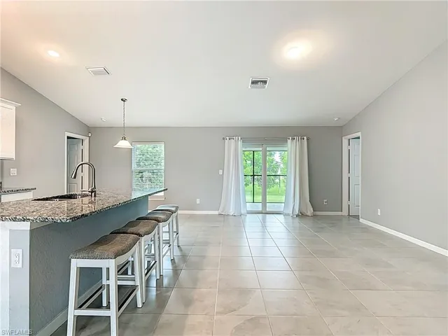 Great room with sliding doors leading to screened lanai