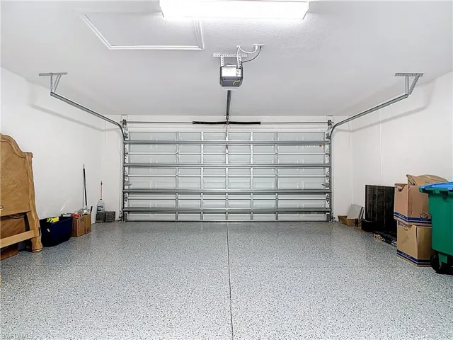 2 car garage with impact rated door and epoxy floor
