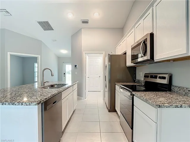 Doorway leads to laundry room then out to garage
