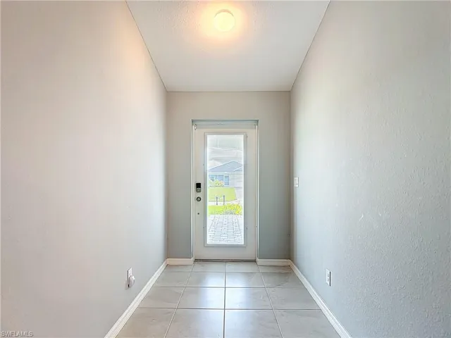 Entrance door with in-glass blinds for ease of care and light control.