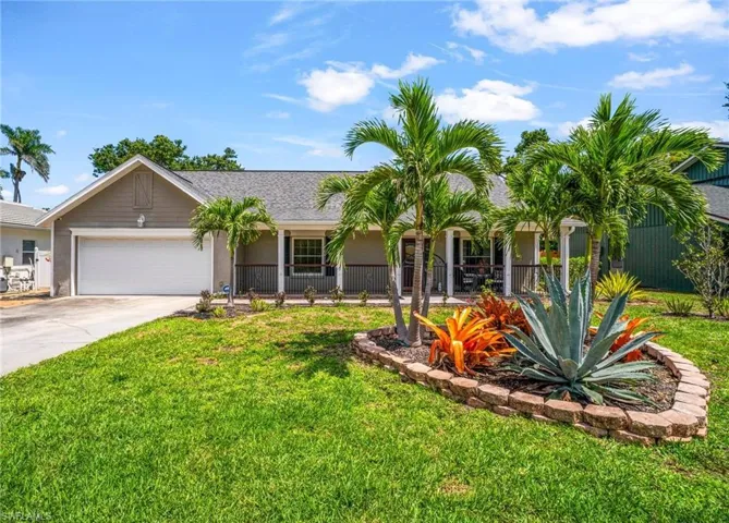 Two story home with a Dble garage, a front porch, and stucco siding