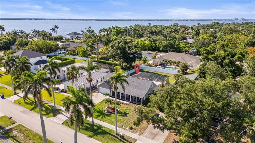 Aerial view of residential area with a nearby body of water