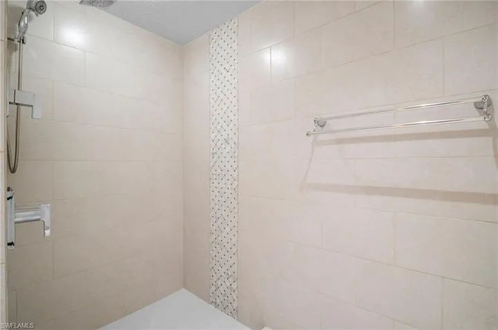Bathroom featuring a tile shower