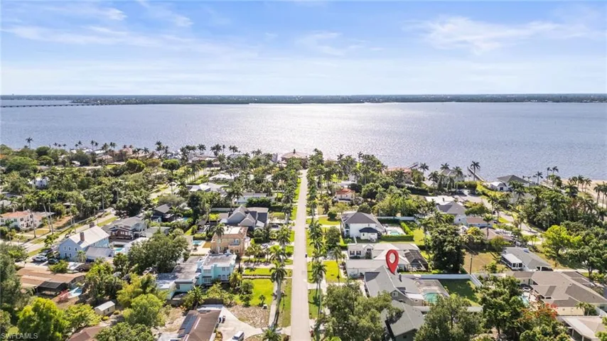 Aerial perspective of suburban area with a nearby body of water