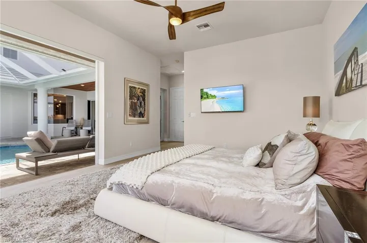 Bedroom with wood finished floors and ceiling fan