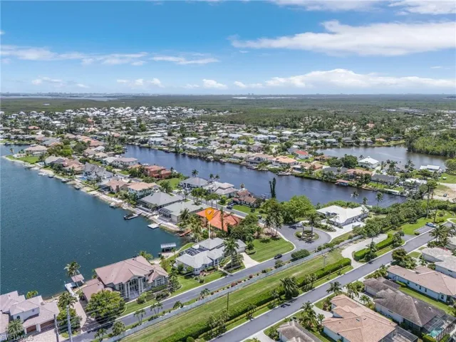 View of property location with nearby suburban area and a nearby body of water