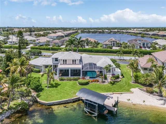Aerial perspective of suburban area with a large body of water