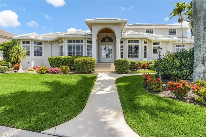View of front of house with a front yard