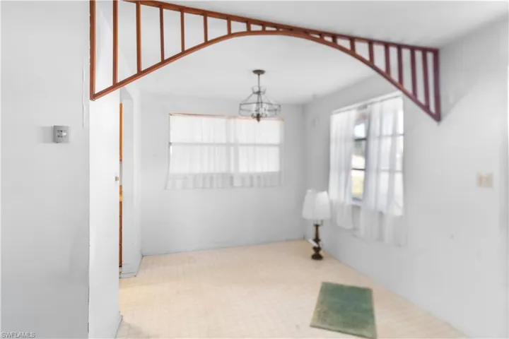 Spare room featuring an inviting chandelier