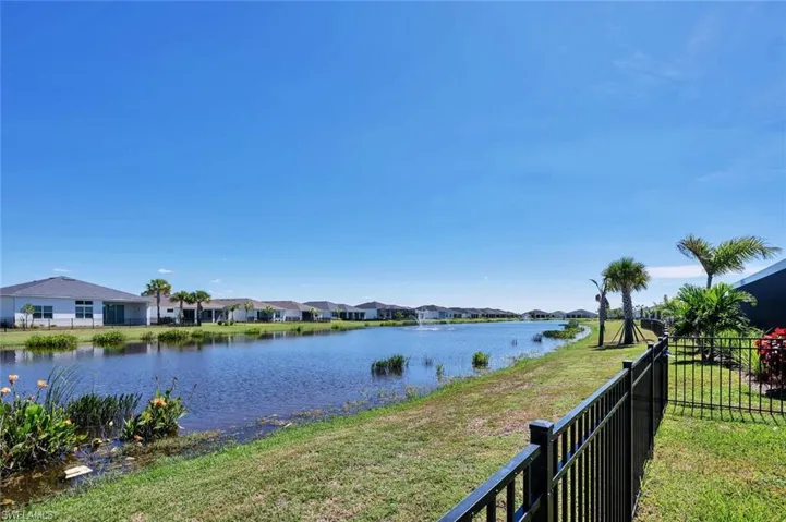 Expansive fenced east-facing yard with serene lake views—perfect for your dream pool and pets.