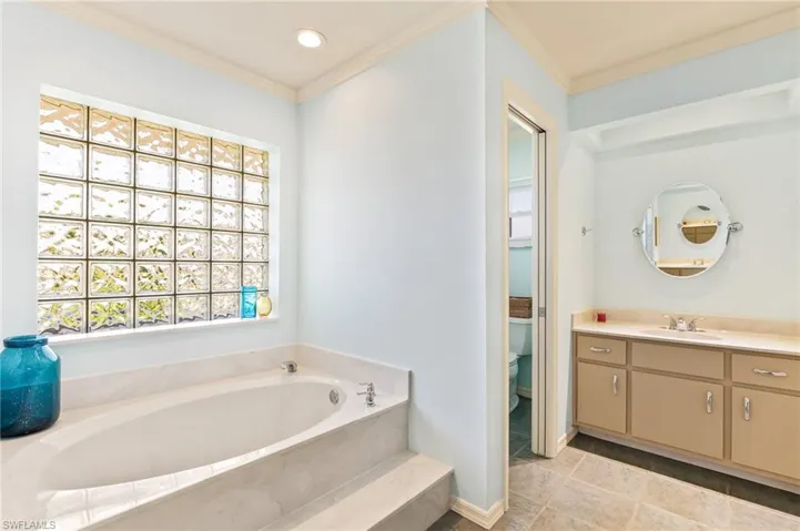 Generous sized primary bedroom opens to the pool area