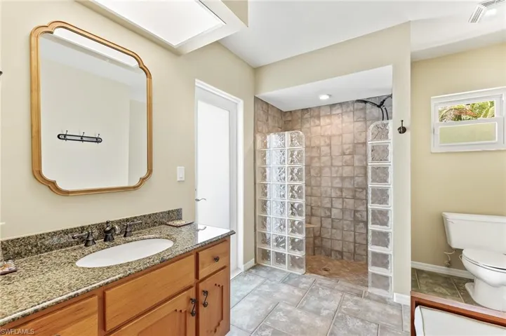 Ensuite bath for the 2nd primary bedroom. Walk-in shower. Located off the pool this could be used as a pool bath.