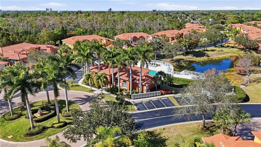 Aerial perspective of suburban area with a nearby body of water