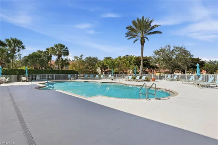 Community pool featuring a patio