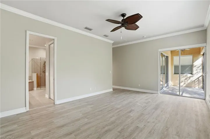 Unfurnished room with ornamental molding, a ceiling fan, and light wood finished floors
